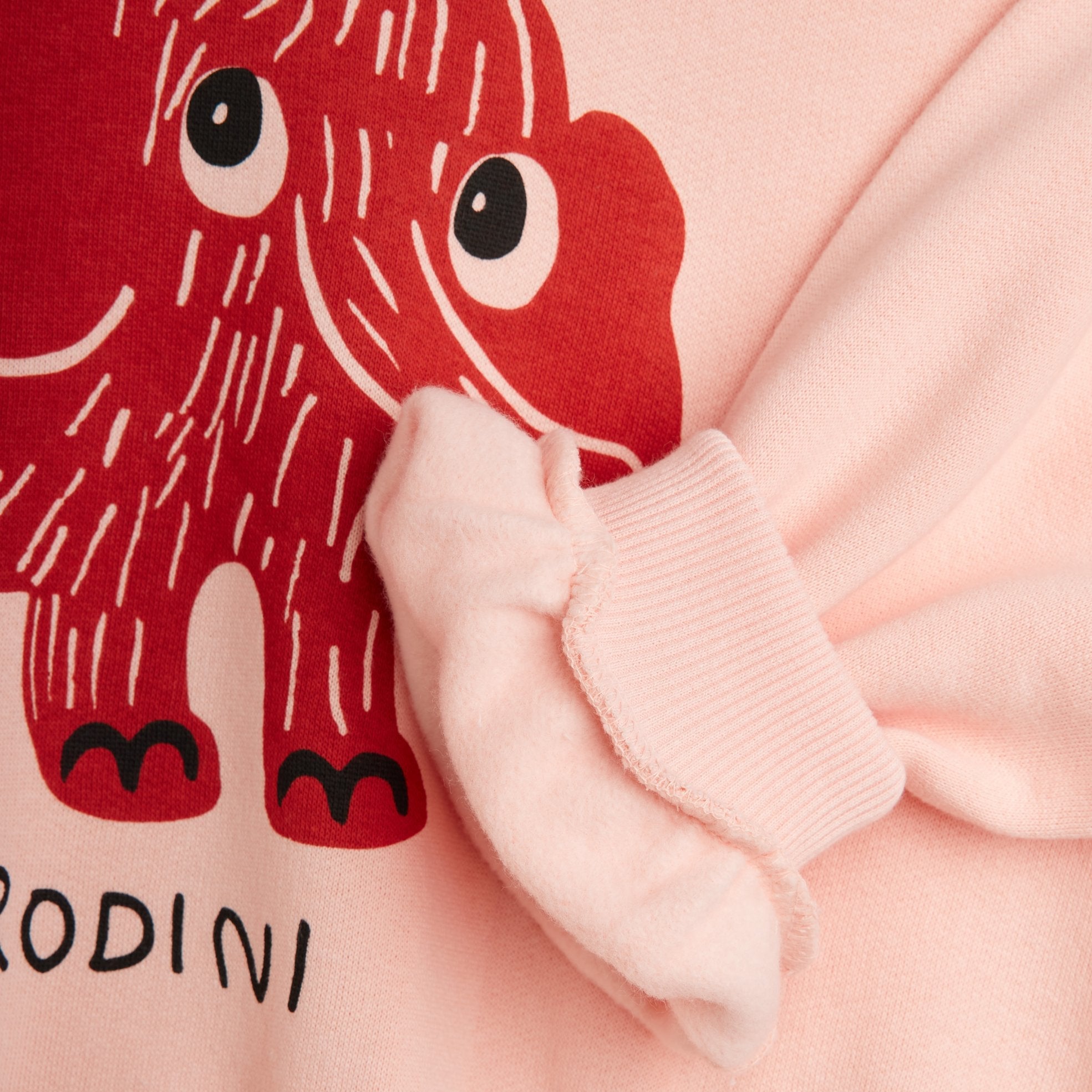 Pink garment with a red cartoon character and Rodini branding - Little-ish