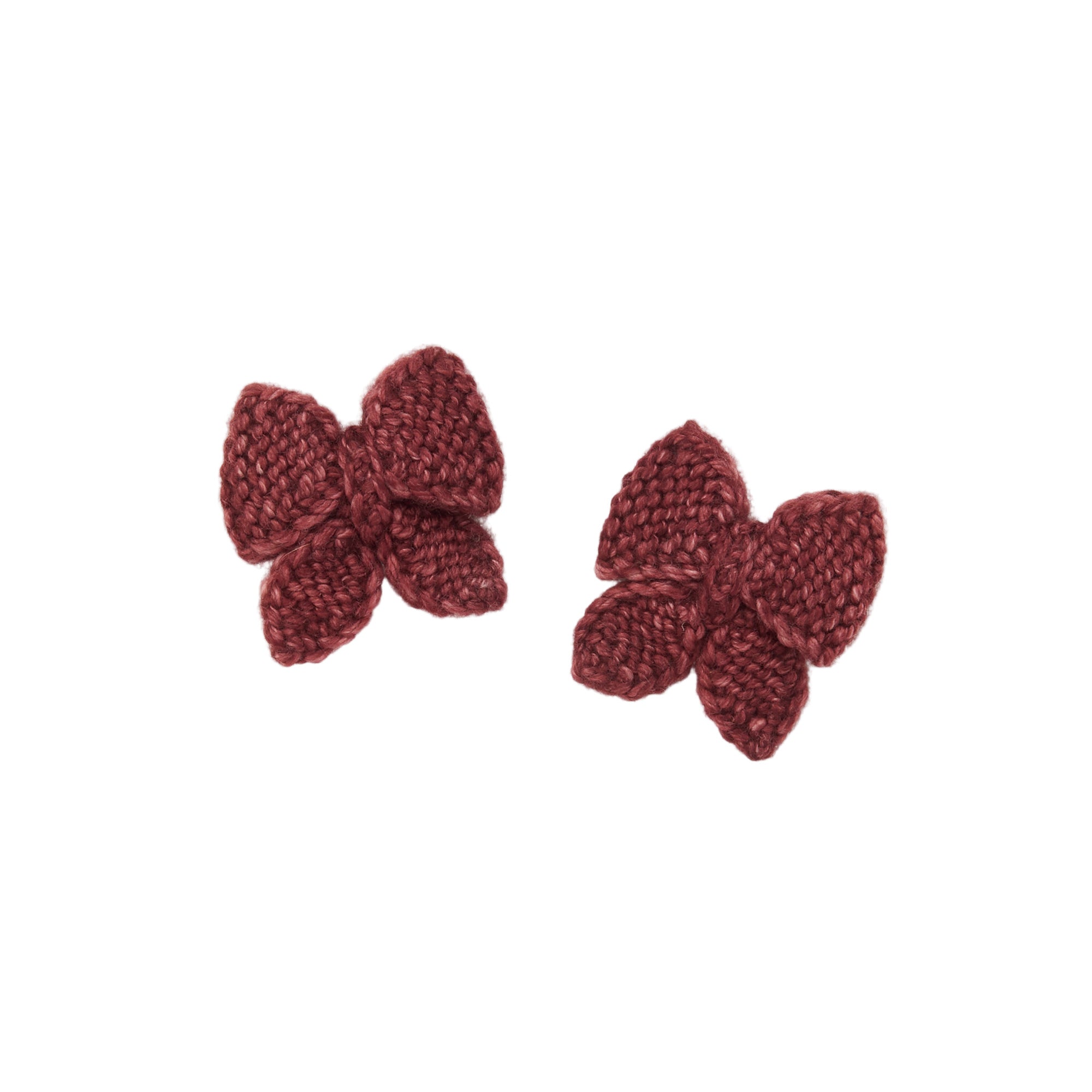 Two knitted butterfly earrings on a beige fabric background - Little-ish
