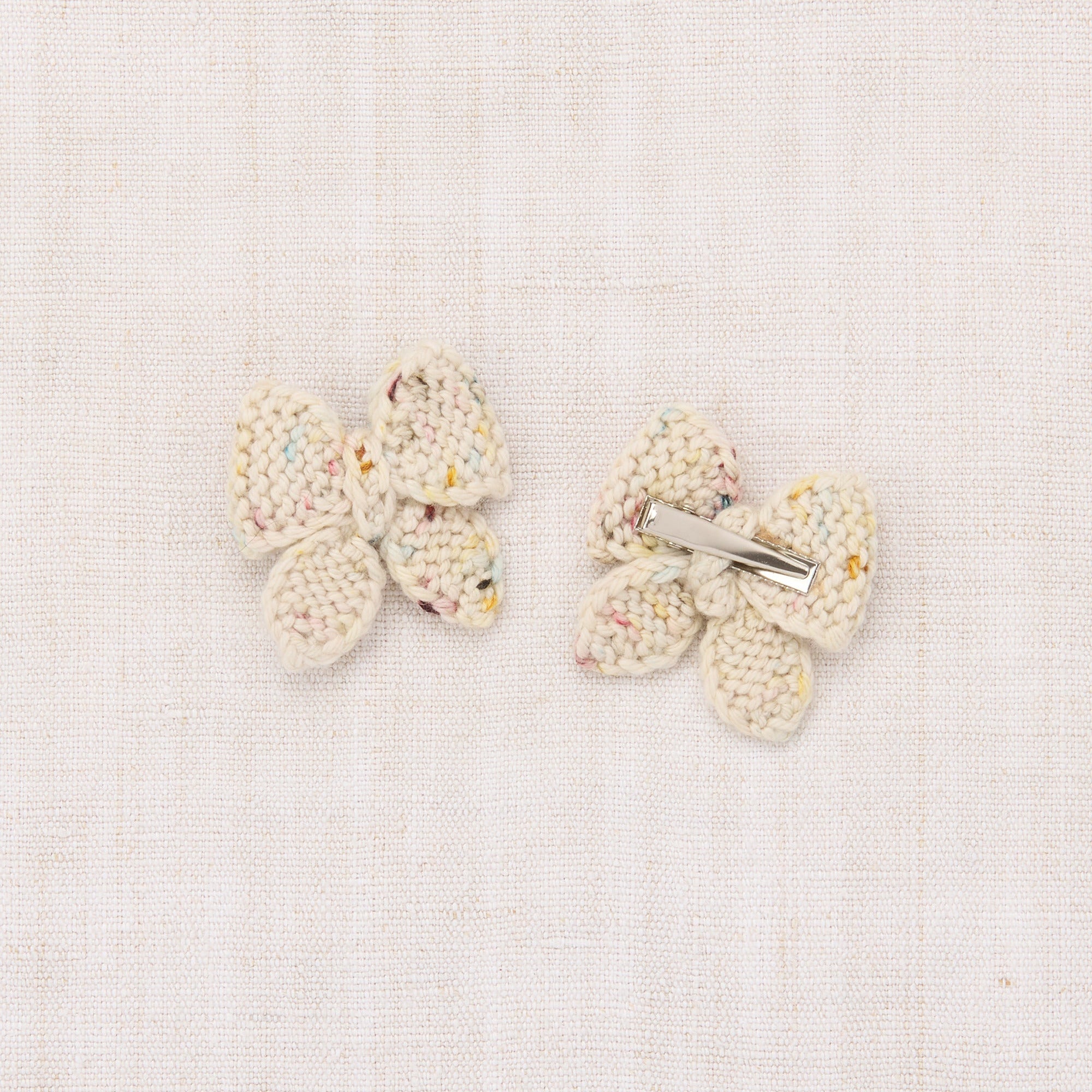 Pair of butterfly-shaped earrings on a light background - Little-ish