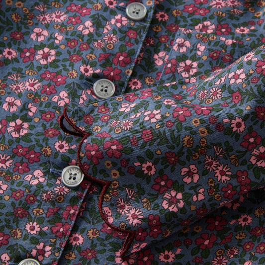 Floral patterned shirt with a close-up of buttons and fabric texture.