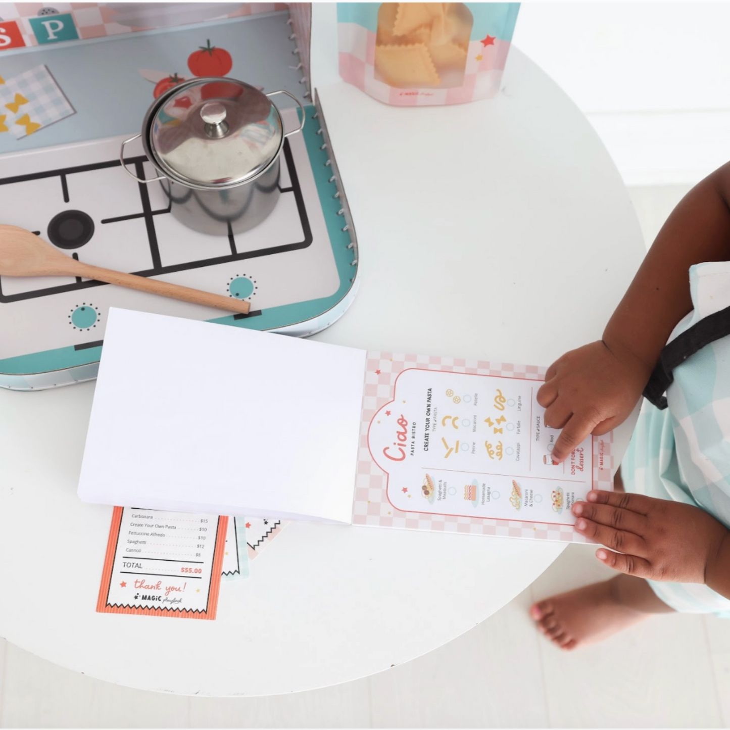 Child interacting with educational materials on a table