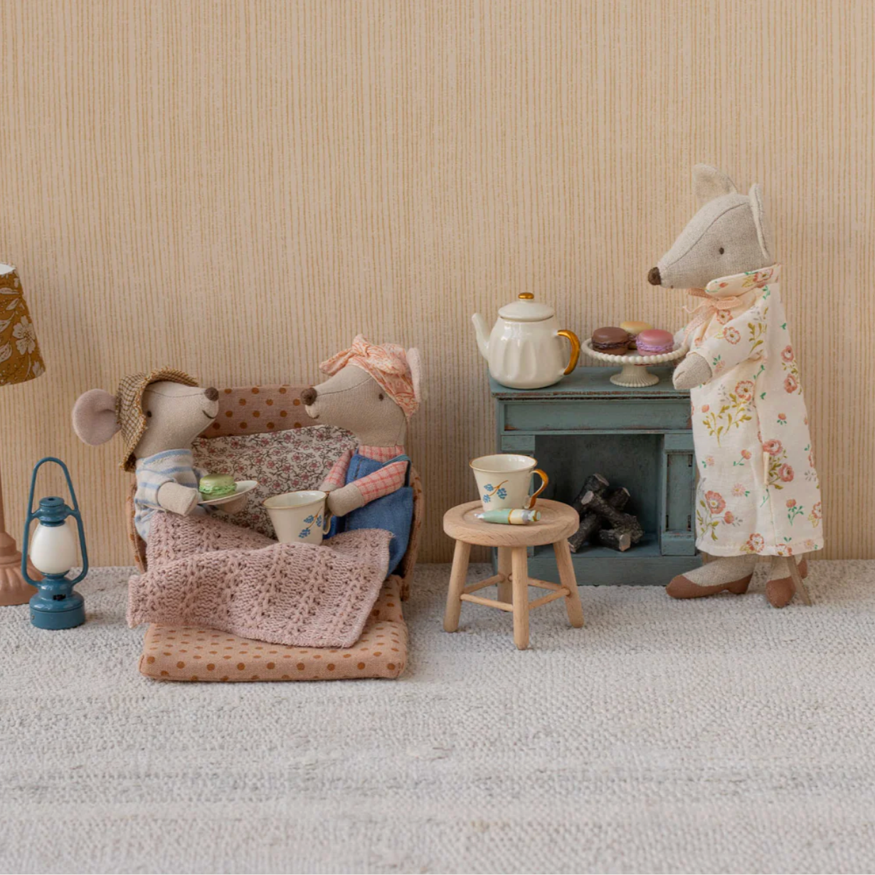 Miniature scene with two toy mice in a cozy room setting. - Little-ish