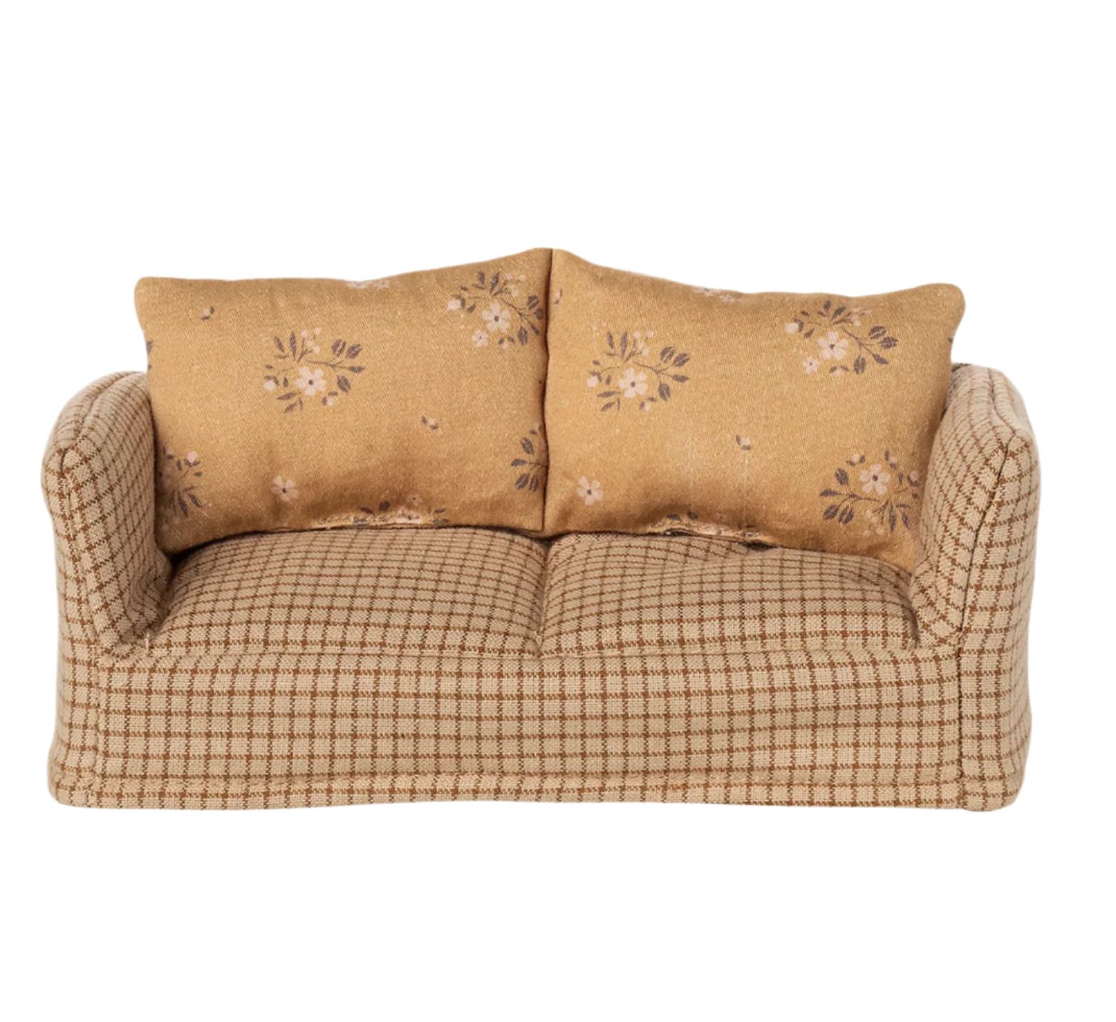 Beige sofa with floral-patterned cushions on a white background - Little-ish