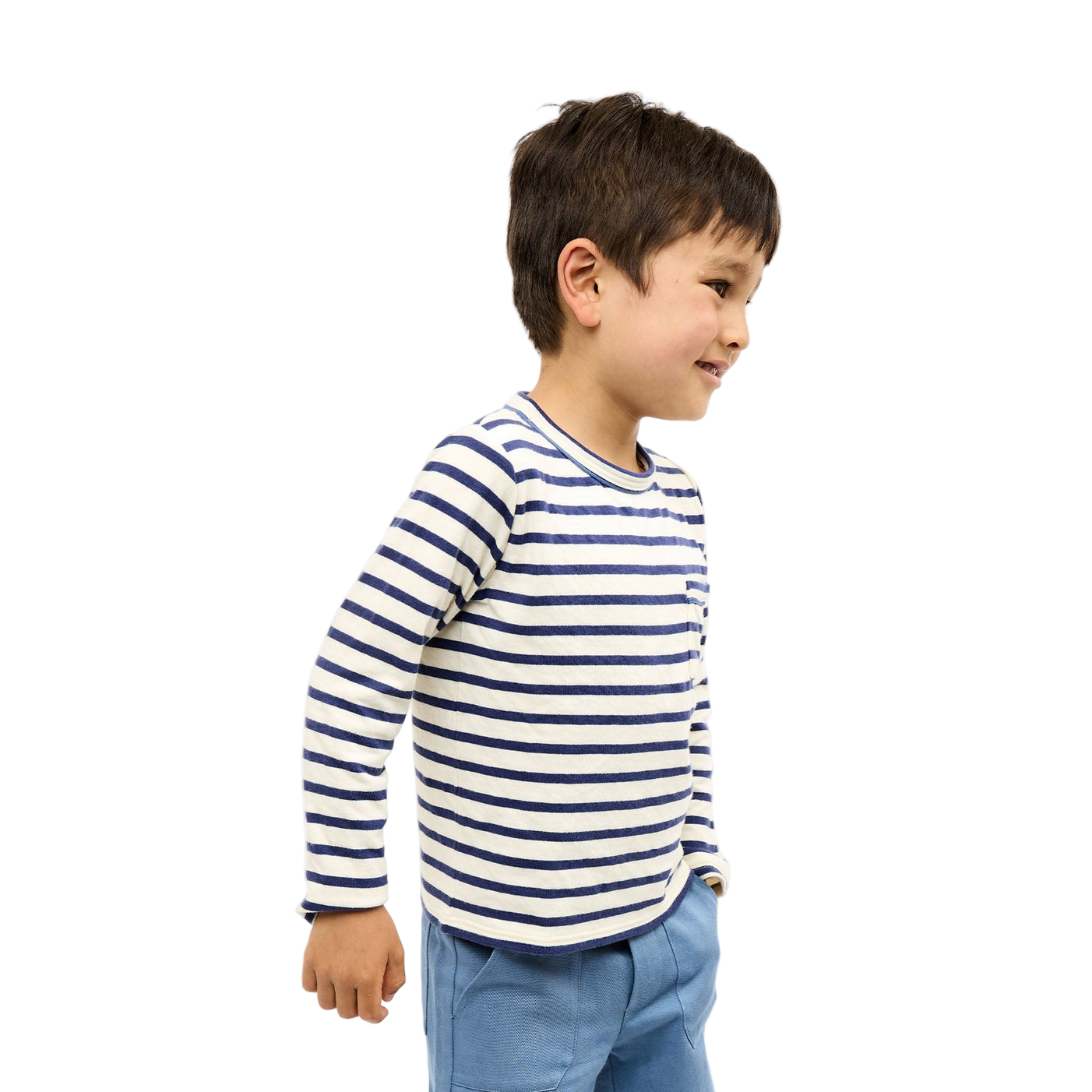 Child wearing a striped shirt and blue pants on a white background - Little-ish