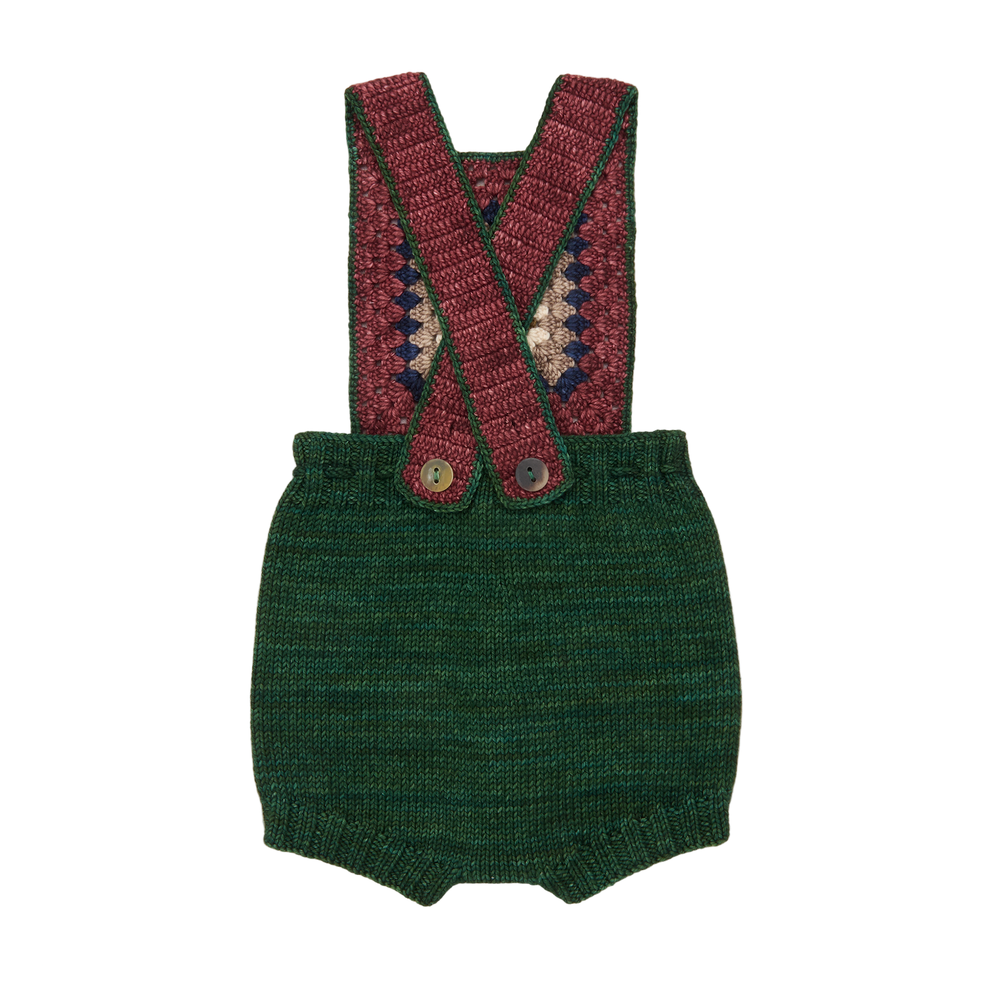 Green knitted romper with red and green suspenders on a white background