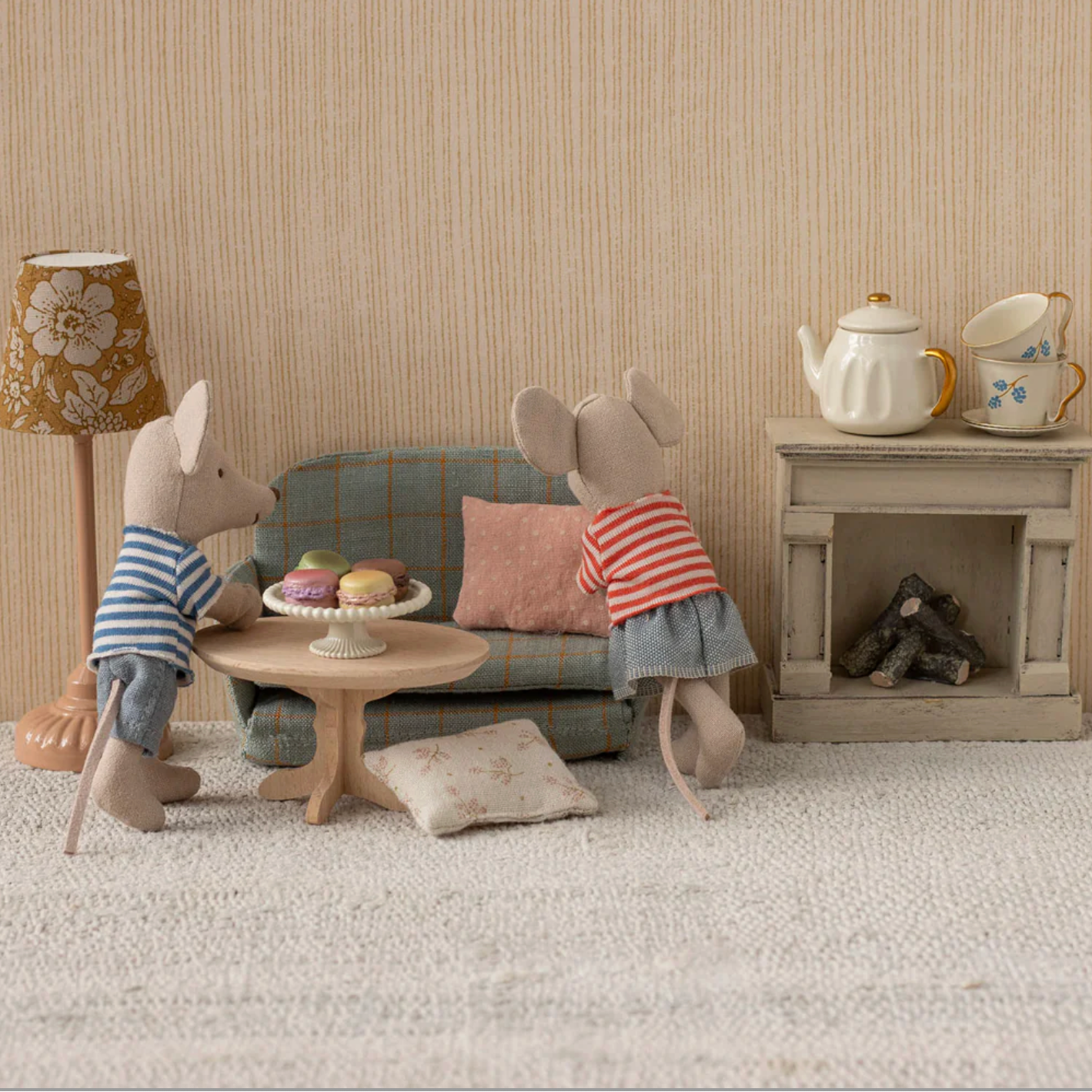 Two toy mice in a living room setting with furniture and decor. - Little-ish