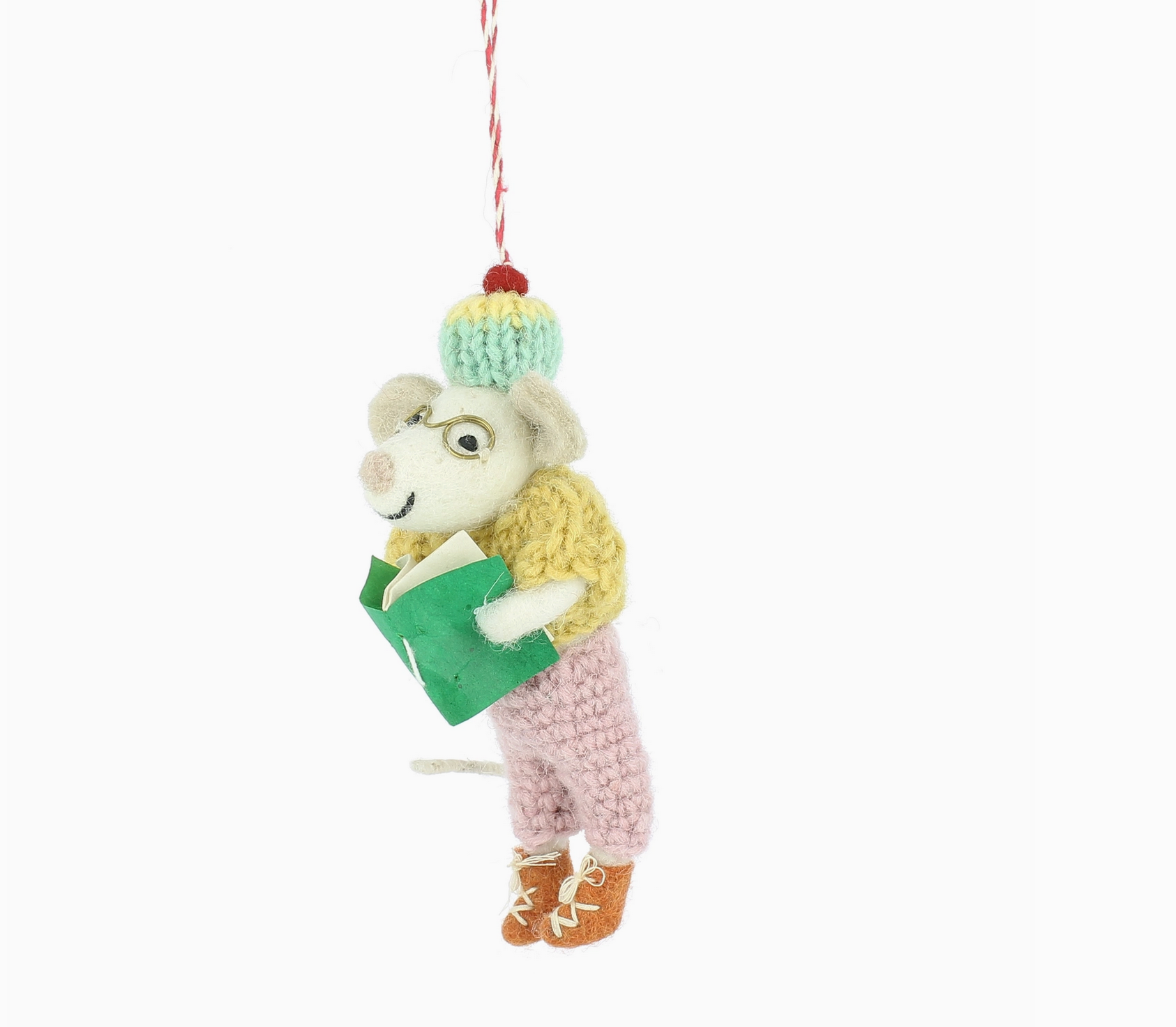 Knitted mouse ornament holding a book on a white background - Little-ish