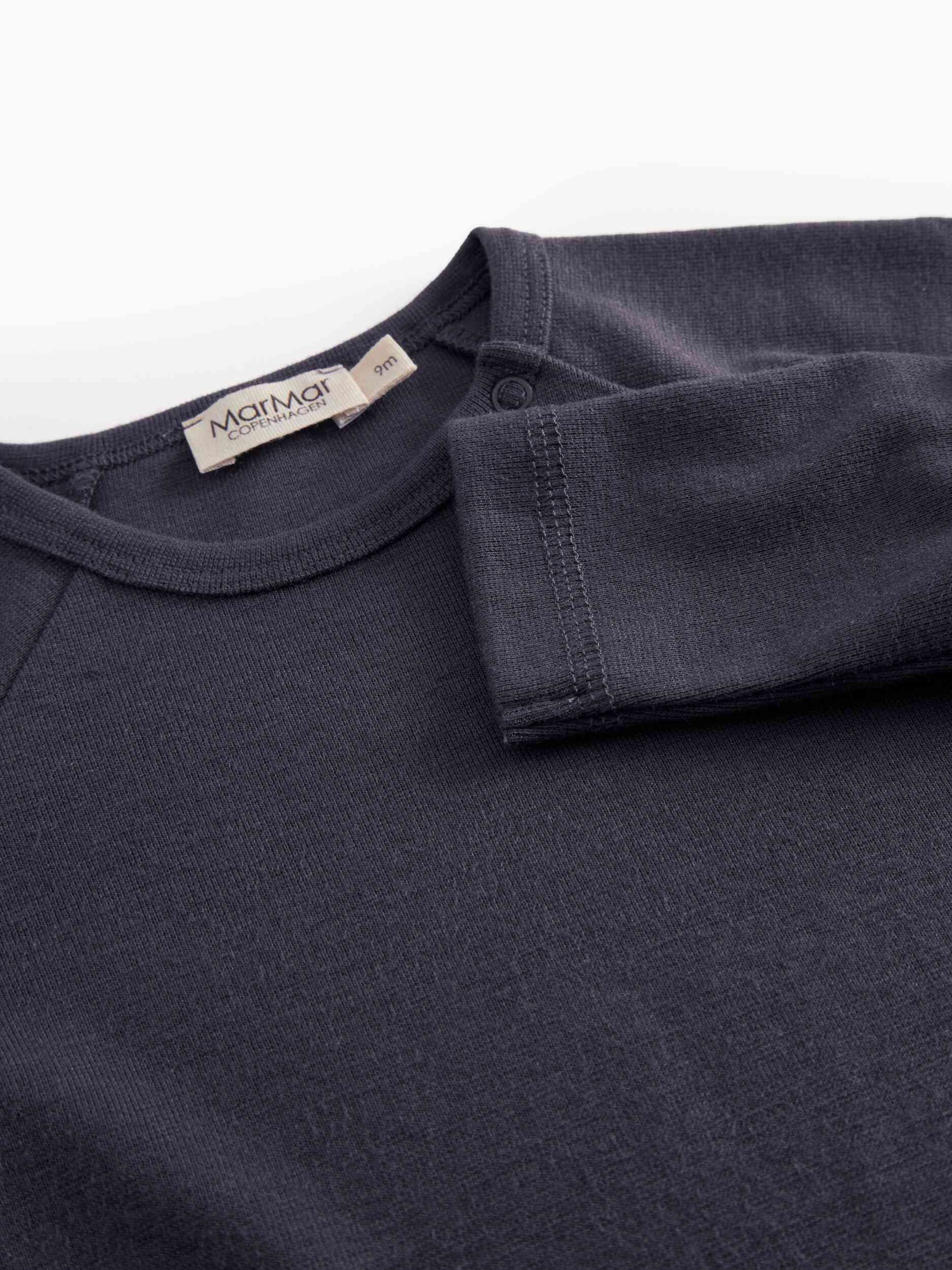 Navy blue shirt with a visible brand label on a white background - Little-ish