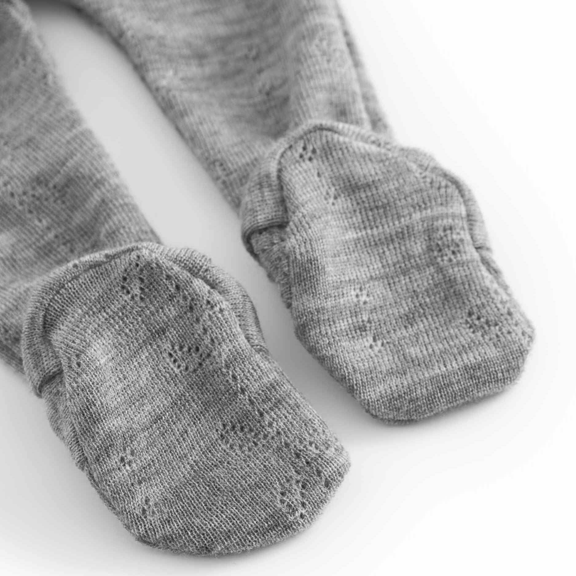 Gray tights with textured finish on a white background