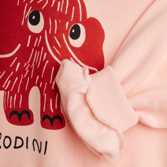 Pink garment with a red cartoon character and Rodini branding