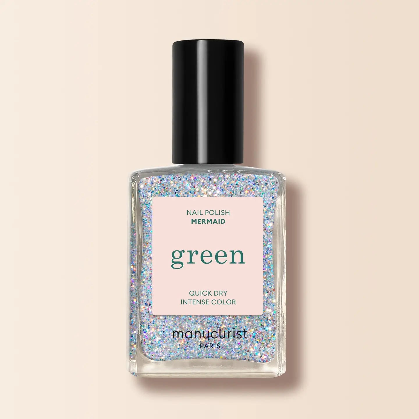 Nail polish bottle with glittery design and 'manucurist' branding on a beige background