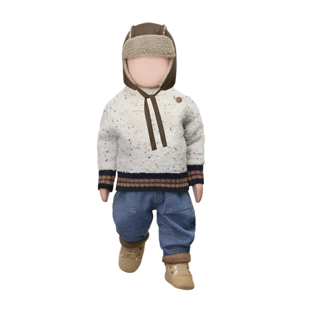 Child's outfit with a speckled sweater, jeans, and boots on a white background
