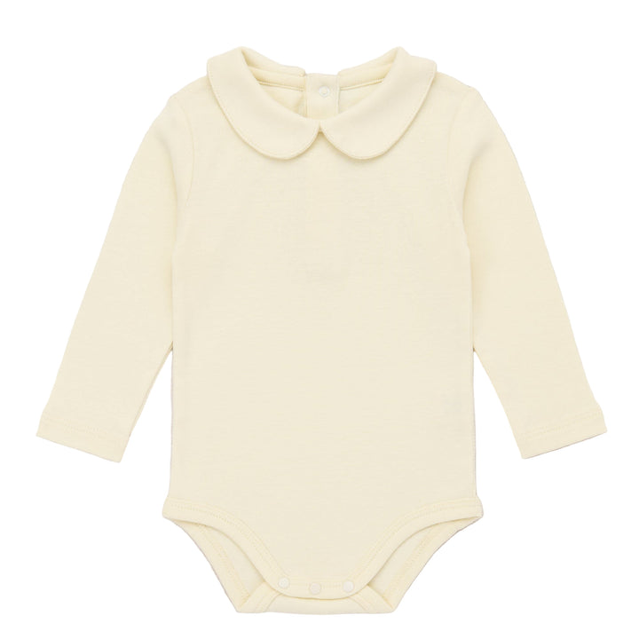 Yellow baby bodysuit with a collar on a light pink background