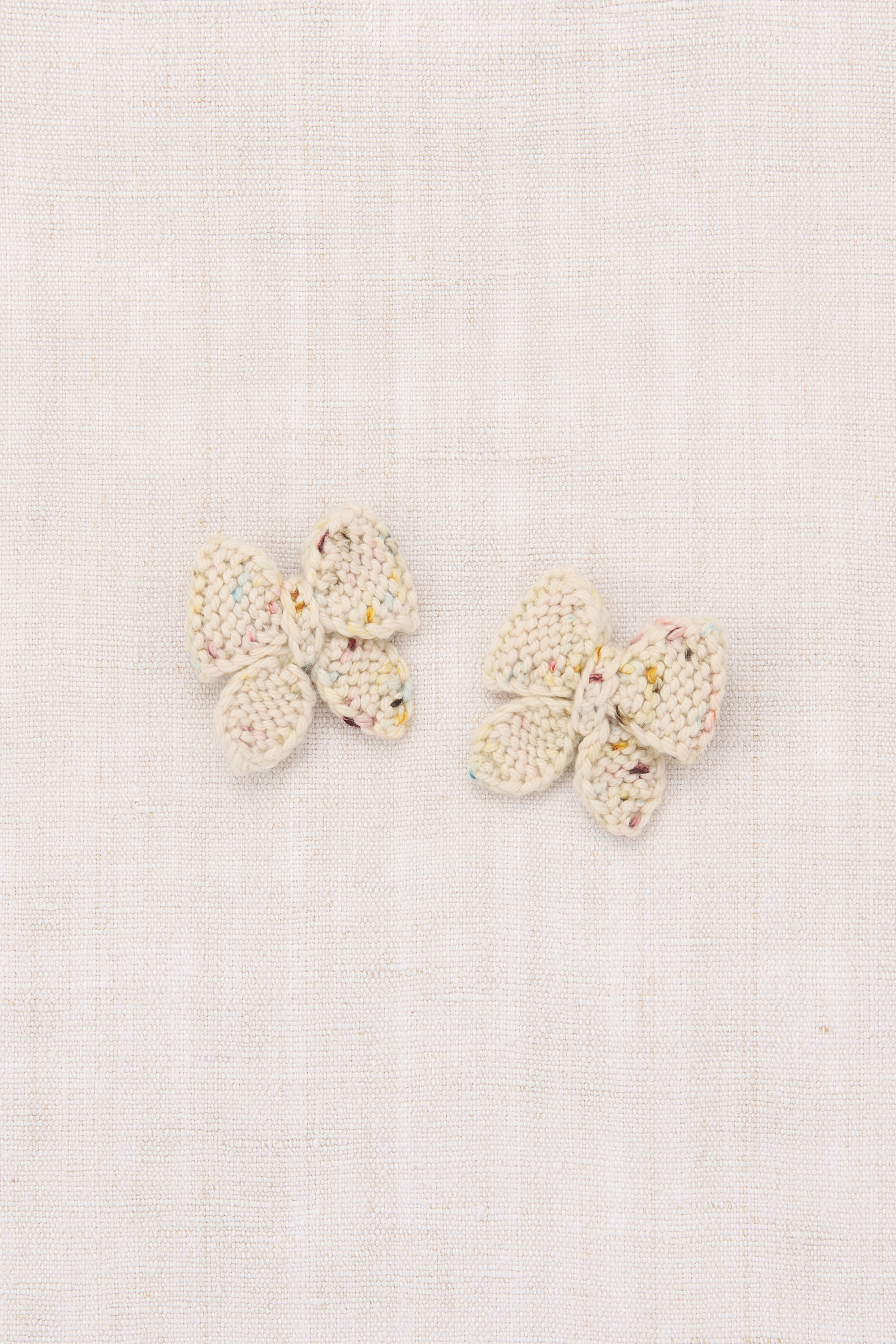 Pair of butterfly-shaped earrings on a light background - Little-ish