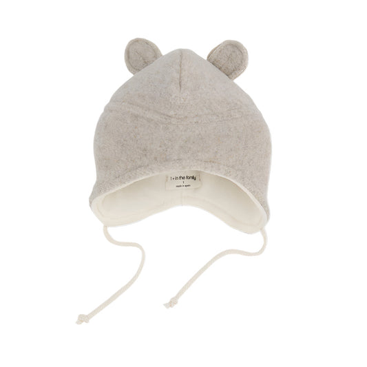Beige baby hat with ear designs on a white background