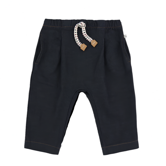 Black pants with a decorative pull cord on a white background