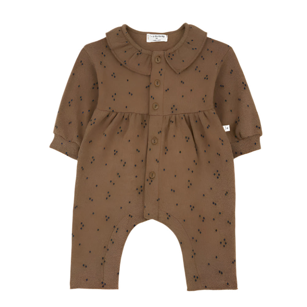 Brown baby romper with black patterns on a white background - Little-ish