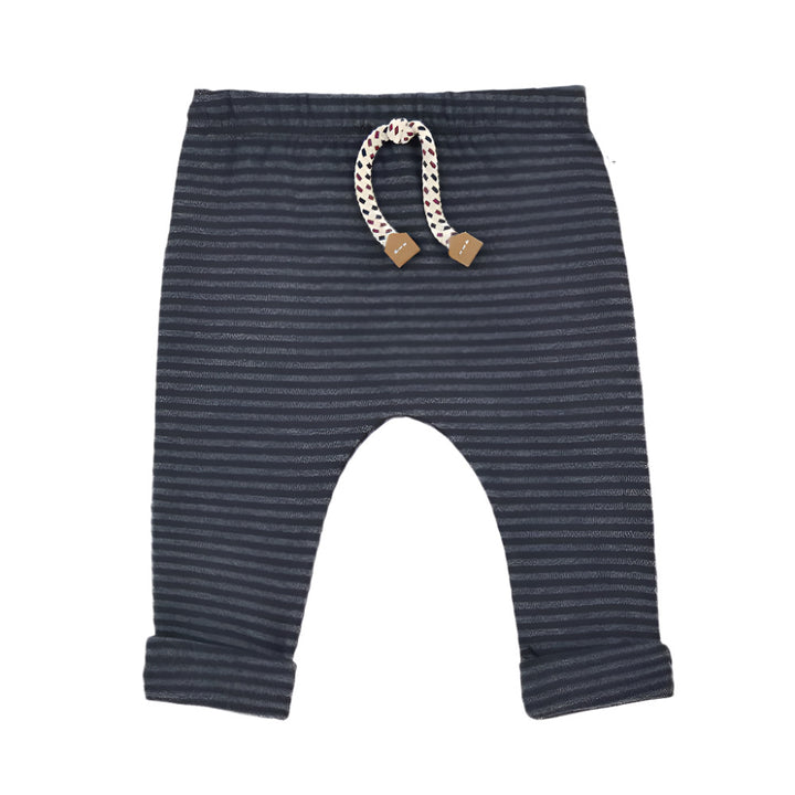 Striped baby pants with a rattle on a white background