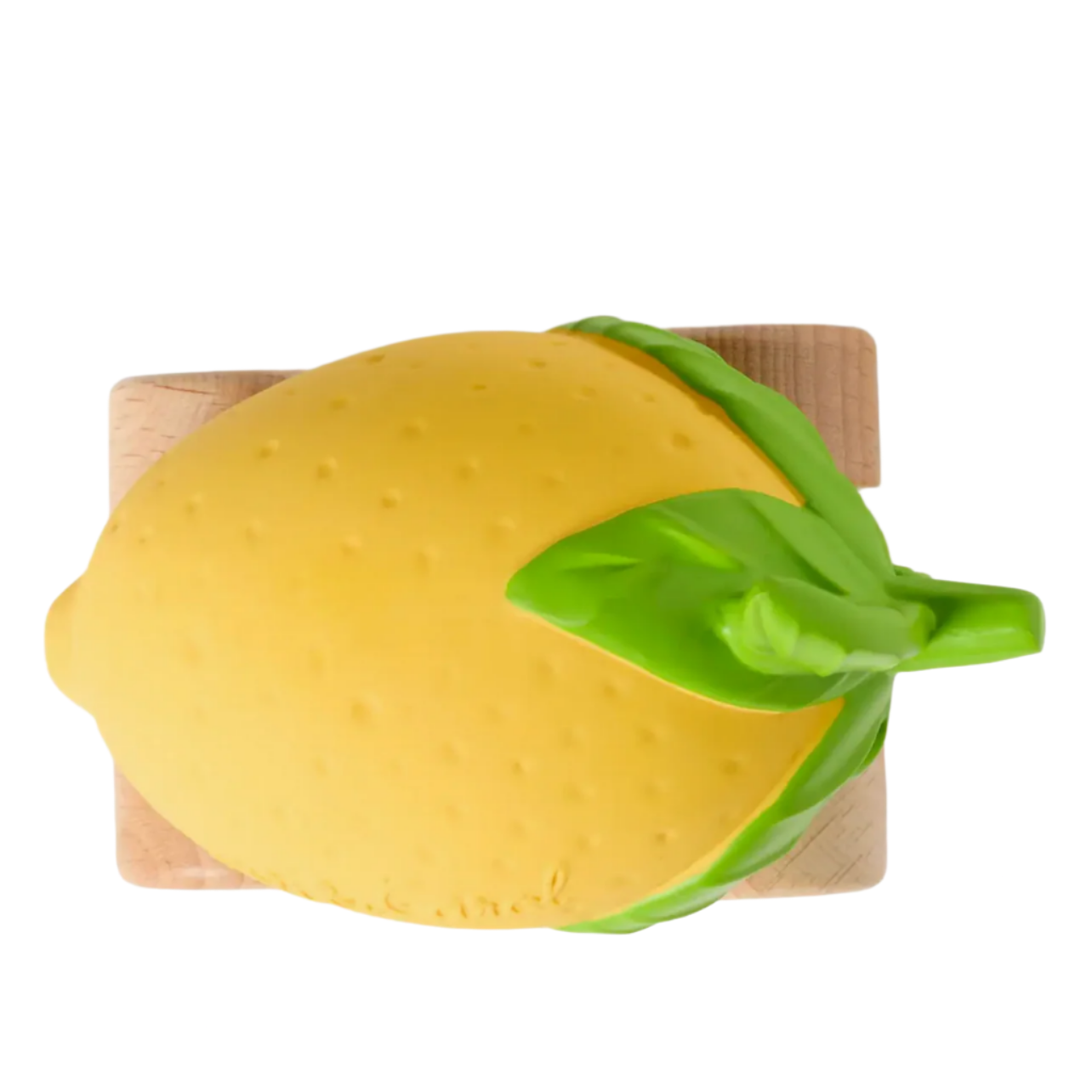 Yellow lemon-shaped object with a green handle on a wooden board against a white background - Little-ish