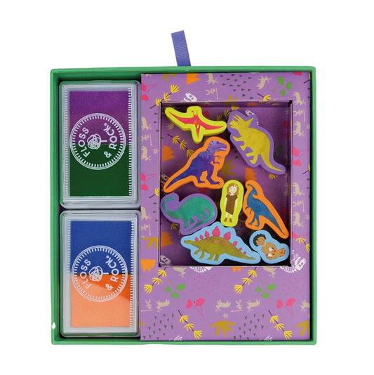 Set of dinosaur-themed playing cards in a decorative box with colorful designs.