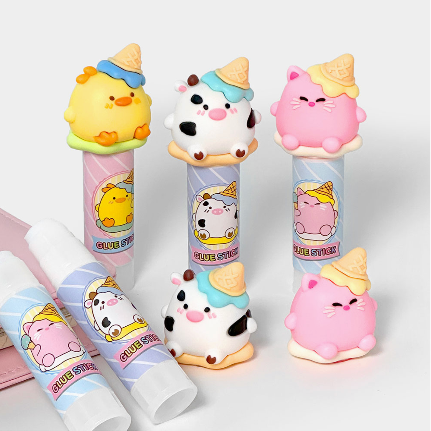 Set of cute animal-themed glue sticks on a white background - Little-ish