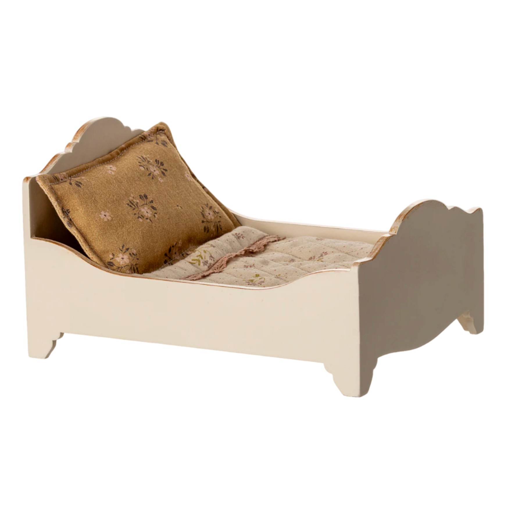 Small bed with a pillow on a white background — Little-ish