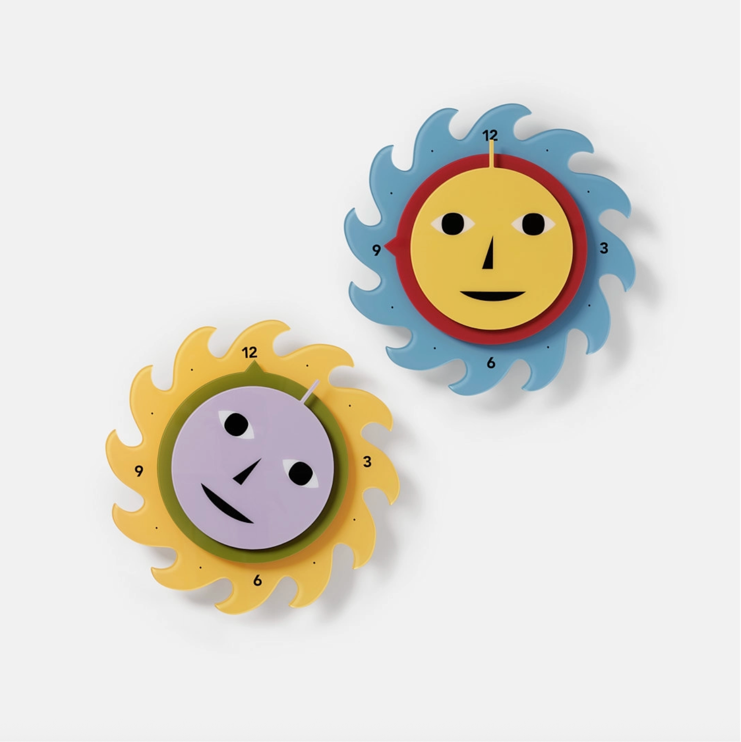 Two colorful wall clocks with sun designs on a white background - Little-ish