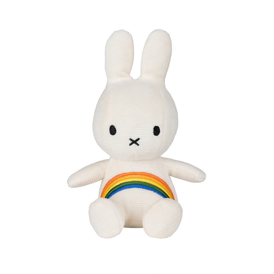 White plush toy with rainbow on a white background