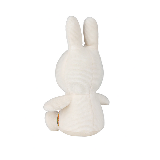 White rabbit-shaped plush toy on a white background