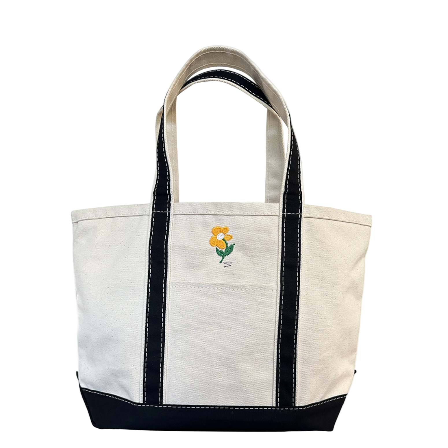 White tote bag with black accents and a small floral emblem on a white background - Little-ish