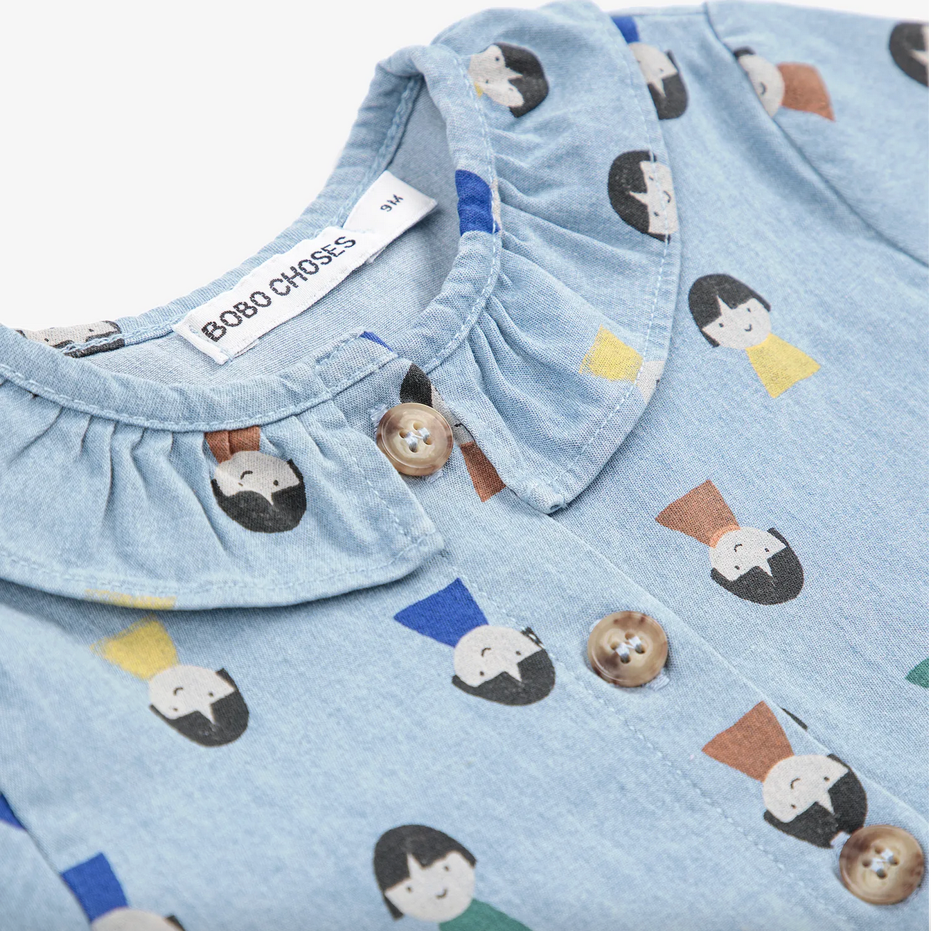 Light blue fabric with cartoon character pattern and Bobo Choses label