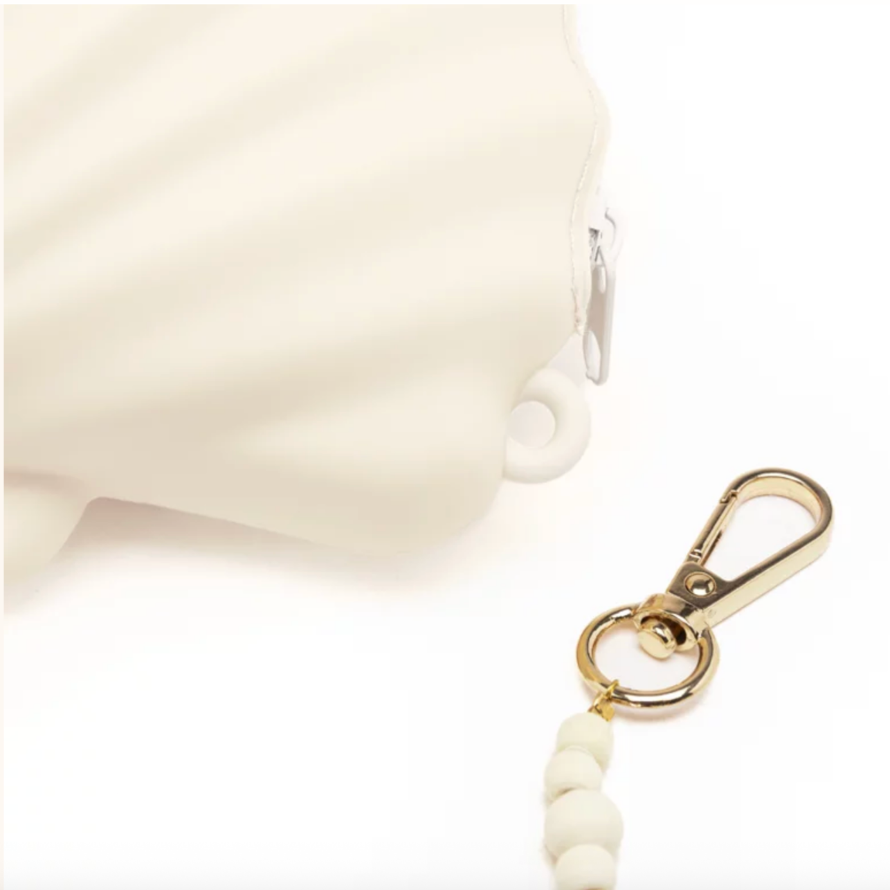White keychain with gold clasp on a white background