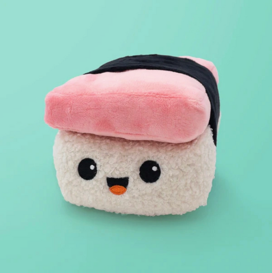 Plush toy resembling a piece of sushi with a pink rice ball on a light green background