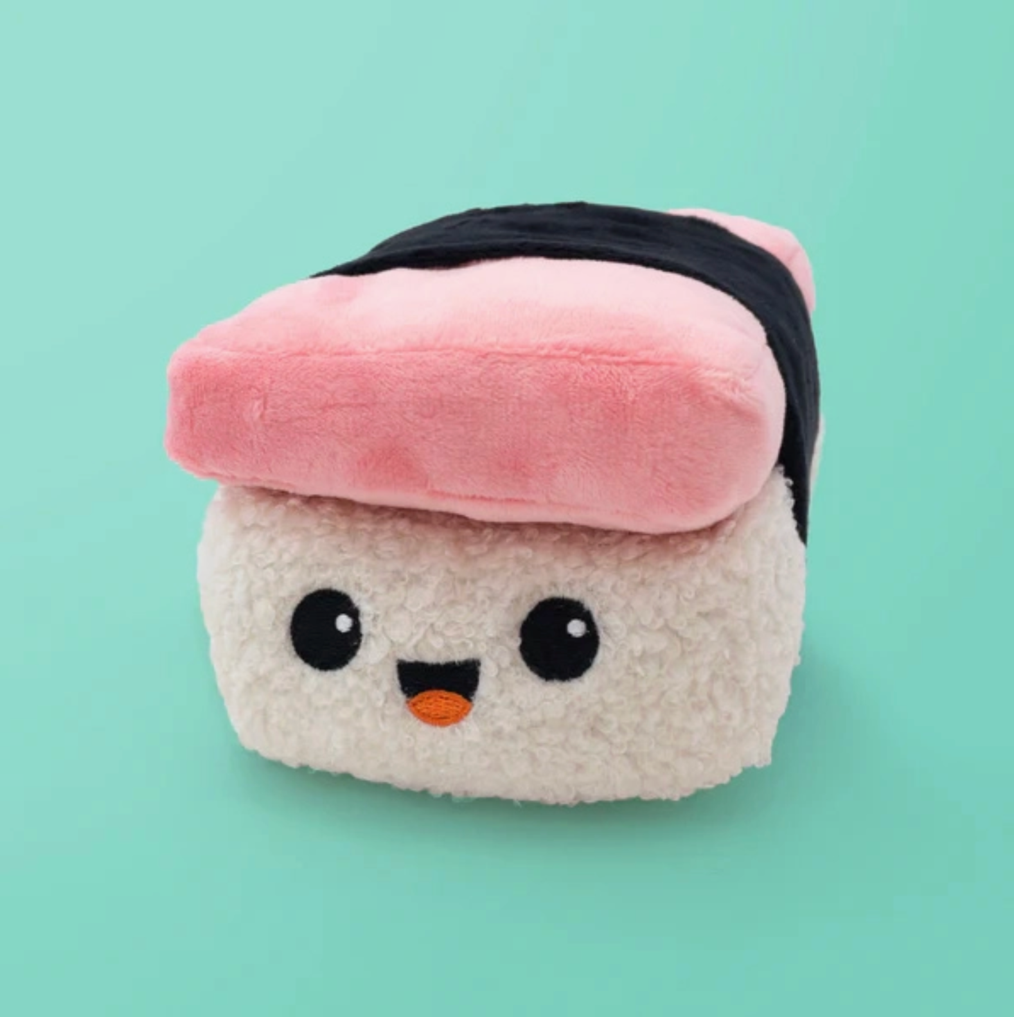 Plush toy resembling a piece of sushi with a pink rice ball on a light green background - Little-ish