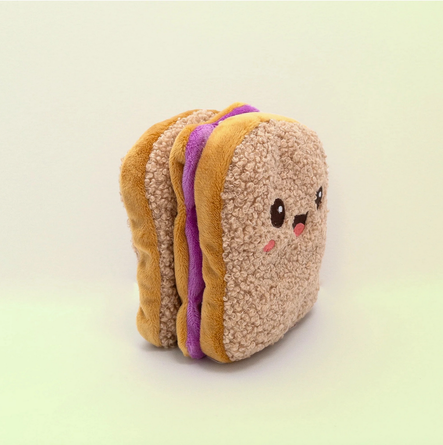 Plush toy resembling a sandwich with a face on a light background - Little-ish