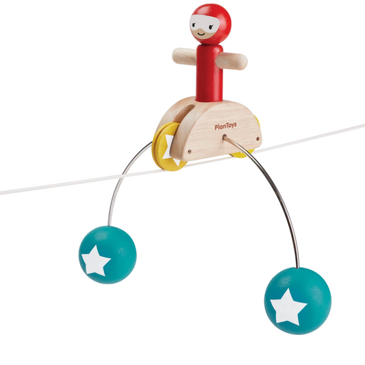 Toy with a character on a string against a white background