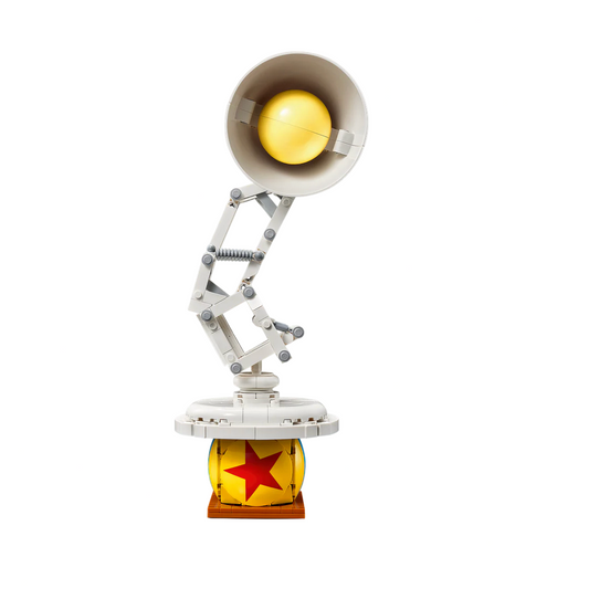 Toy figure of a lamp with a yellow light bulb on a white background