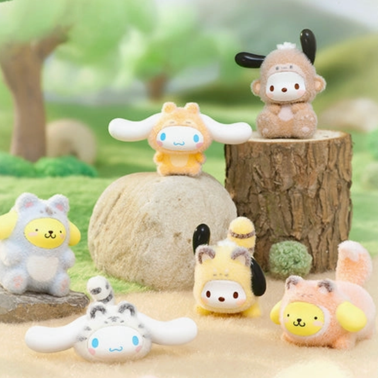 Set of small animal plush toys in a natural setting with trees and rocks. - Little-ish