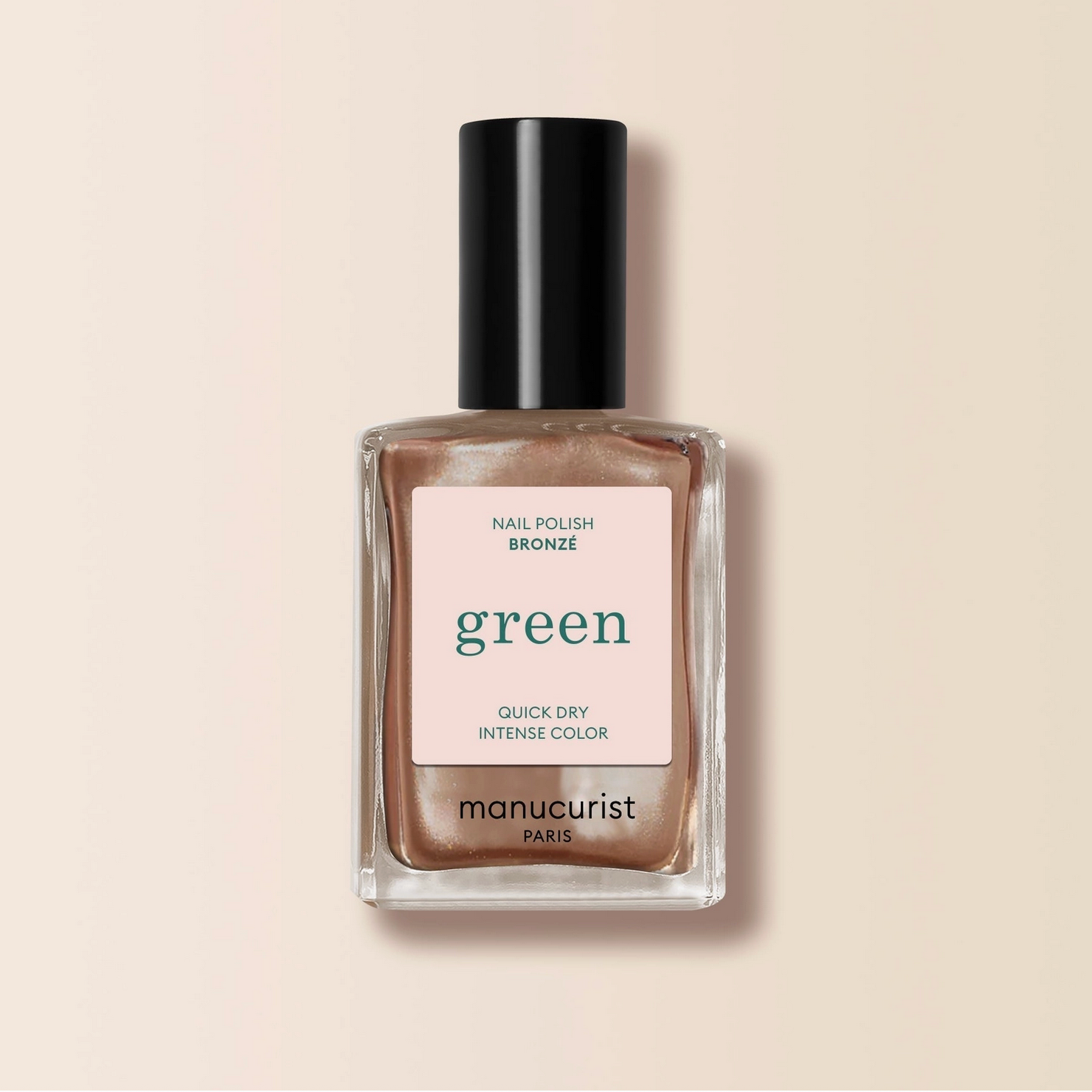 Manucurist nail polish bottle with bronze color on a beige background - Little-ish