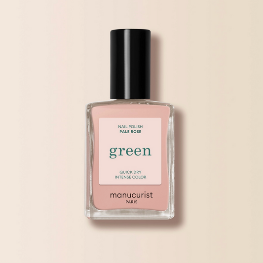 Nail polish bottle with pink label on a beige background