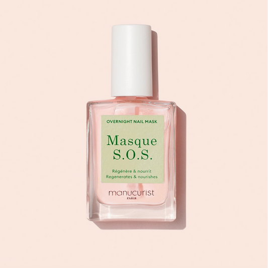 Manucurist Masque S.O.S. overnight nail mask bottle on a beige background