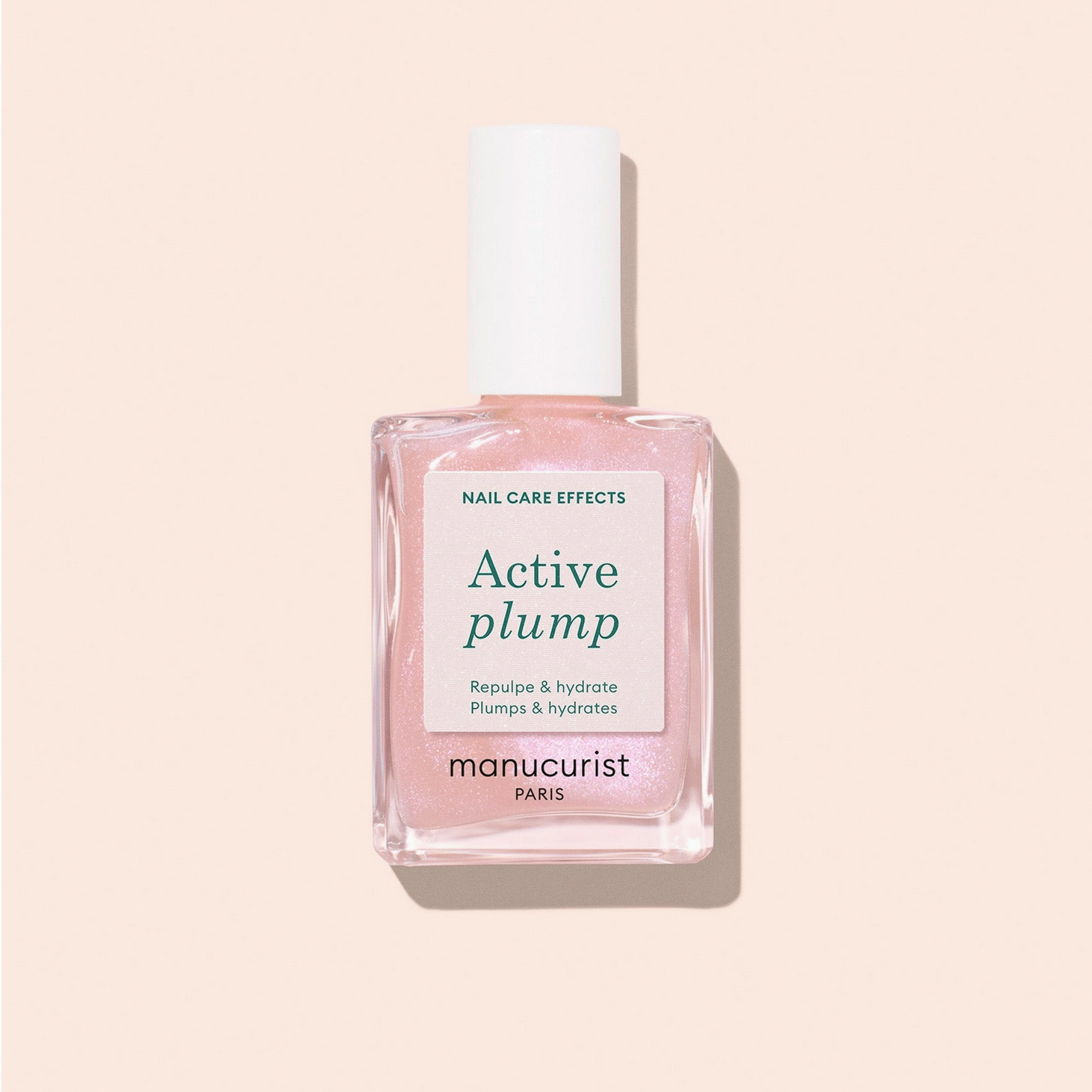 Manucurist Active Plump nail care bottle on a beige background - Little-ish