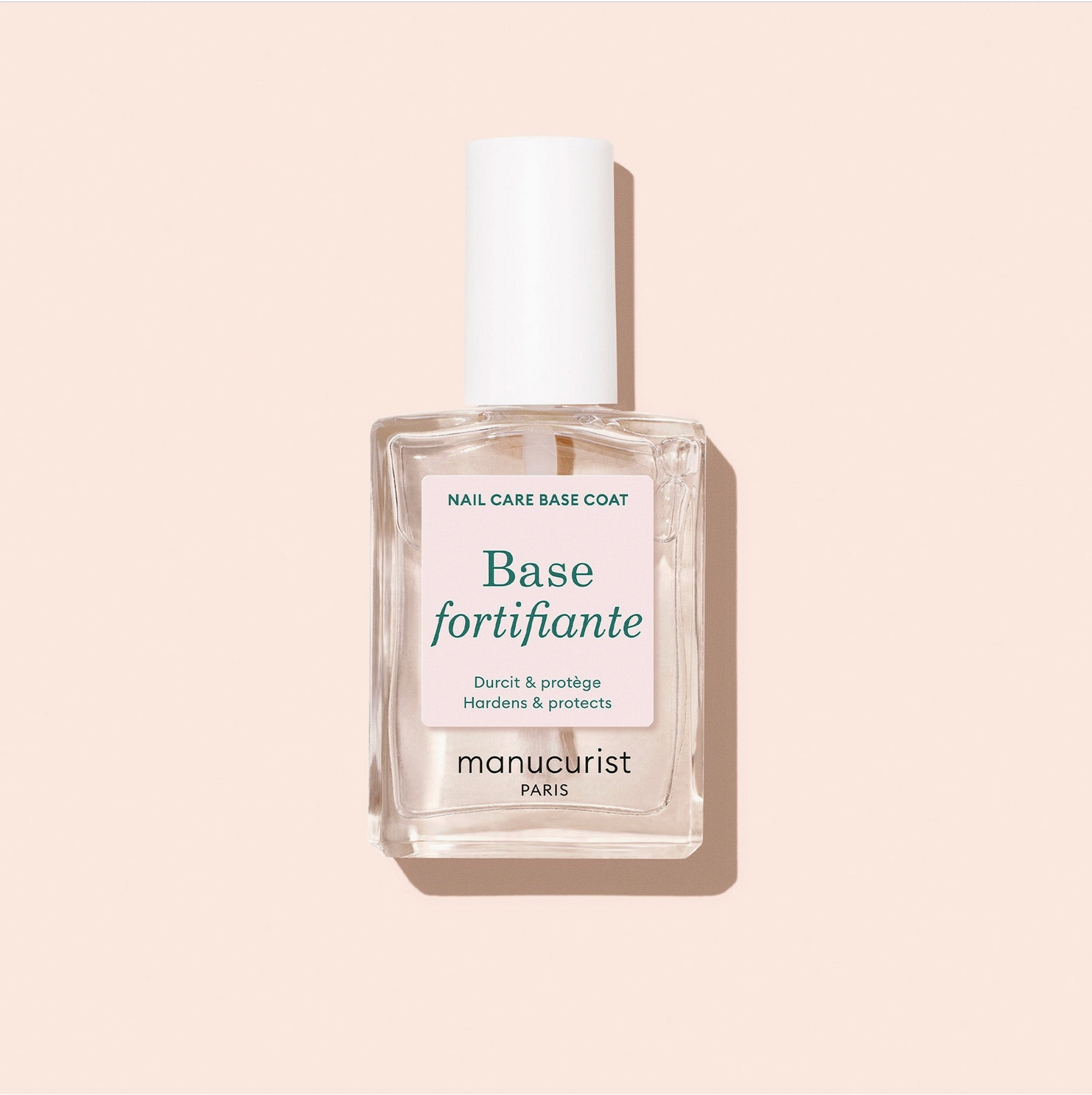 Manucurist nail care base coat bottle on a beige background - Little-ish