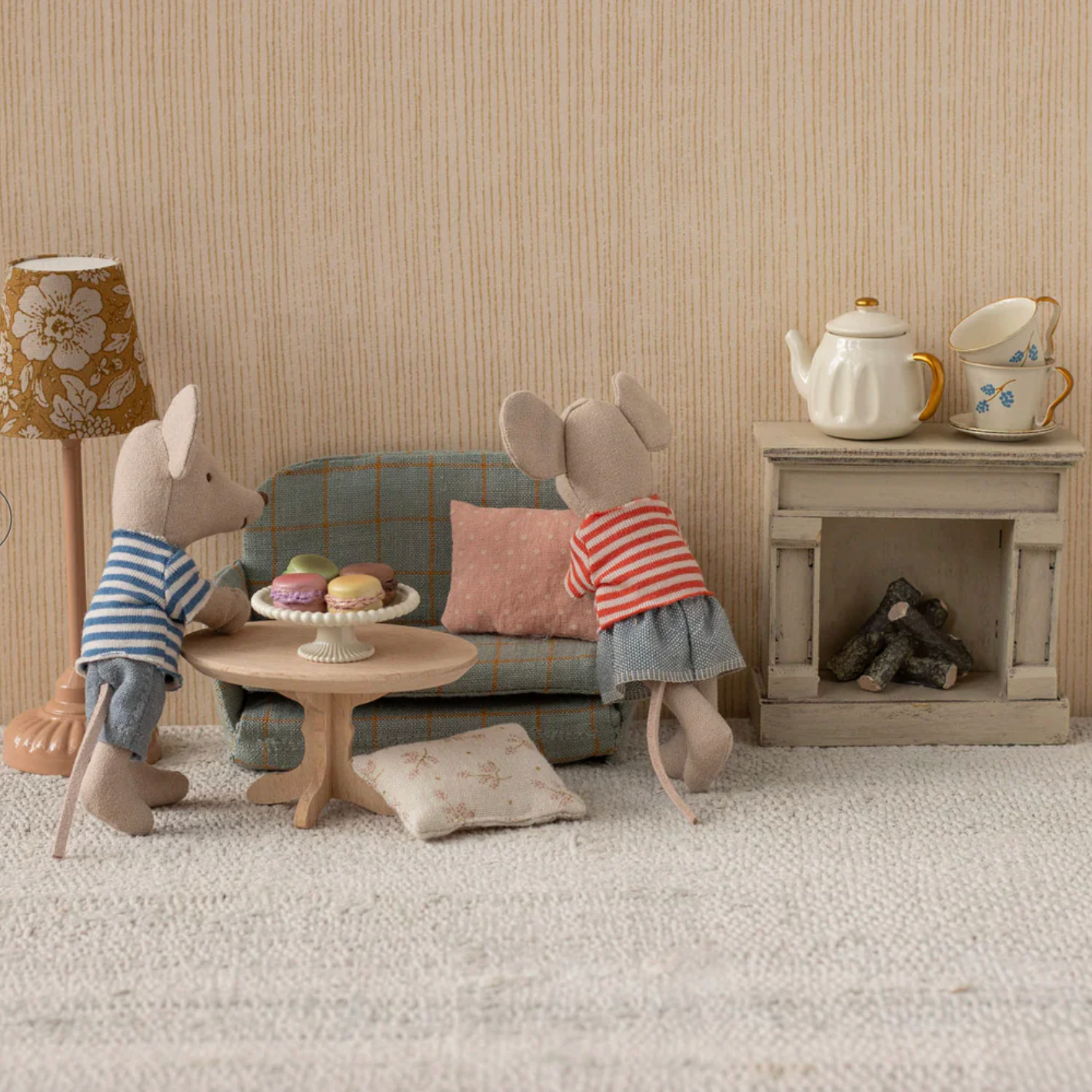 Two toy mice in a living room setting with furniture and decor. - Little-ish