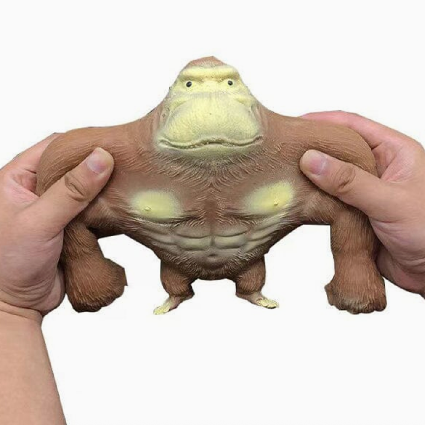 Toy figure of a muscular creature held by two hands on a white background - Little-ish