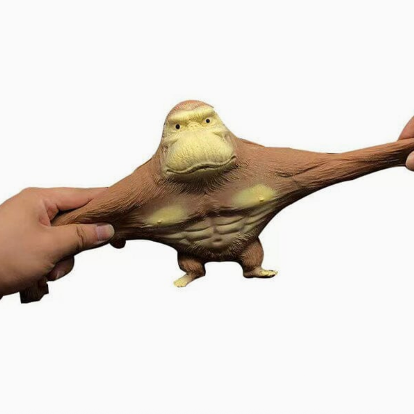 Toy resembling a creature with a long neck and a hand holding it on a white background