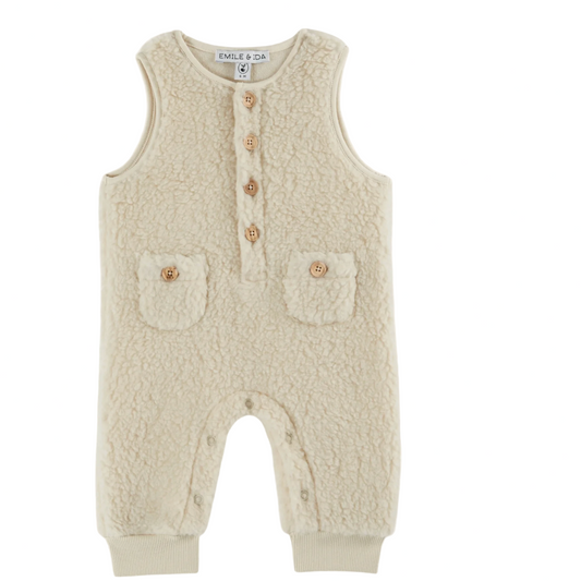 Beige baby romper with button details on a website page