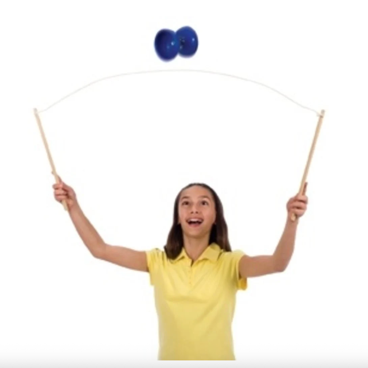 Girl in yellow shirt playing with a blue top and white strings on a white background