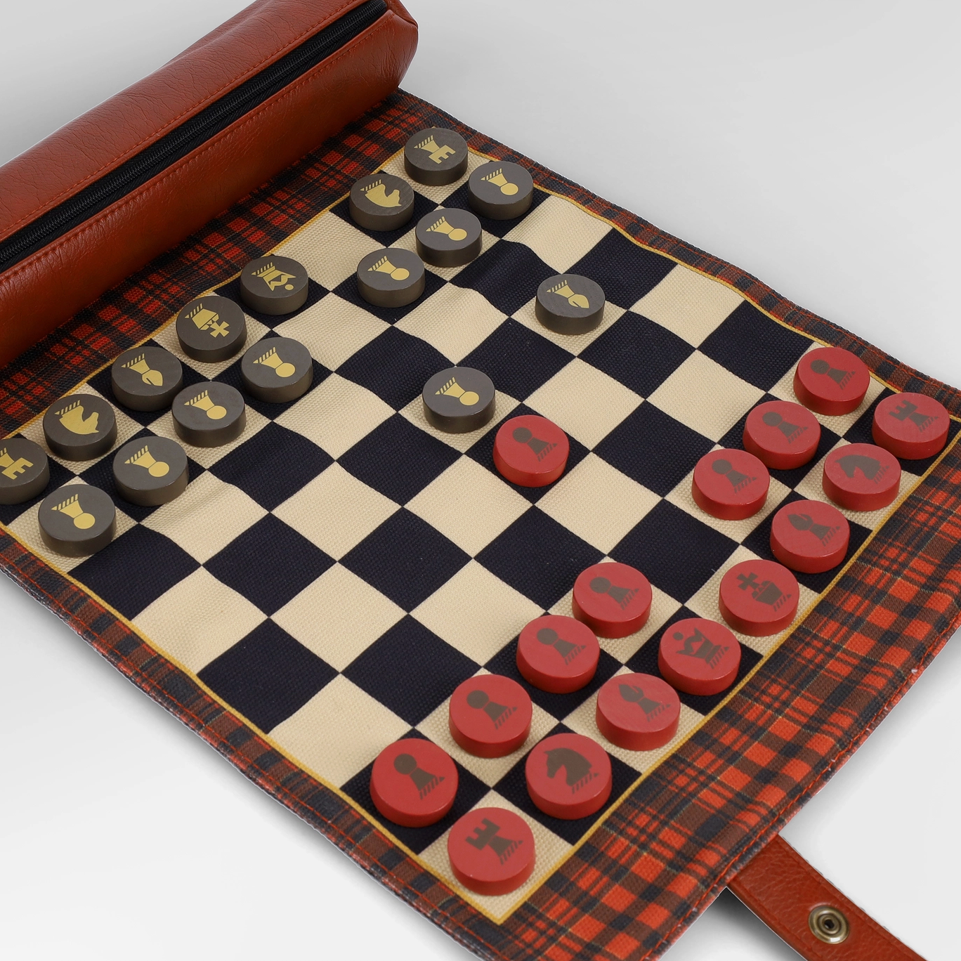 Checkers game set with red and black pieces on a checkered board, in a plaid case.