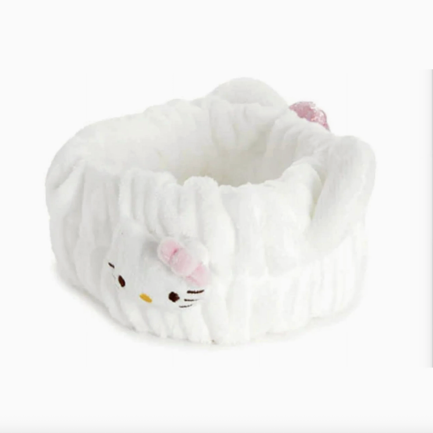 White plush slippers with a cat face design on a white background